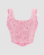 Pink floral 1950s corset with ribbon details, waist training design for parties and weddings.