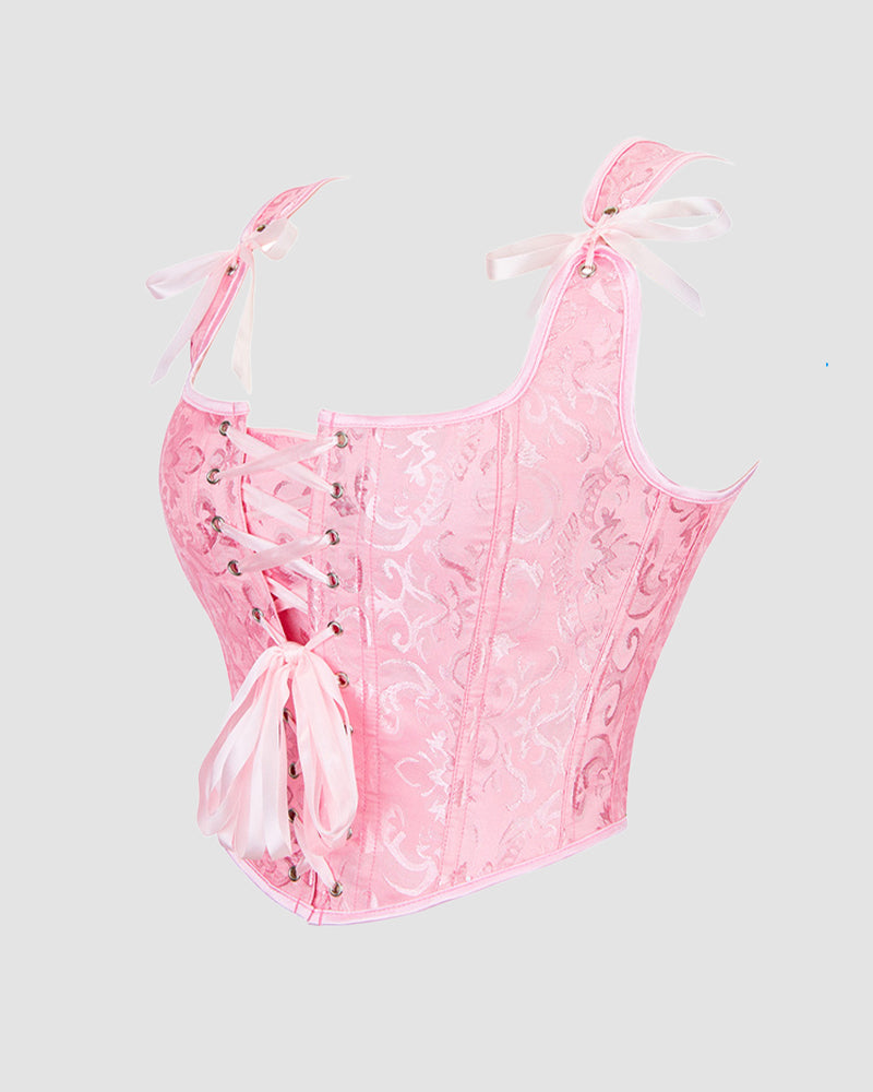 Pink floral 1950s corset with lace-up front and ribbon details. Waist training design for parties.
