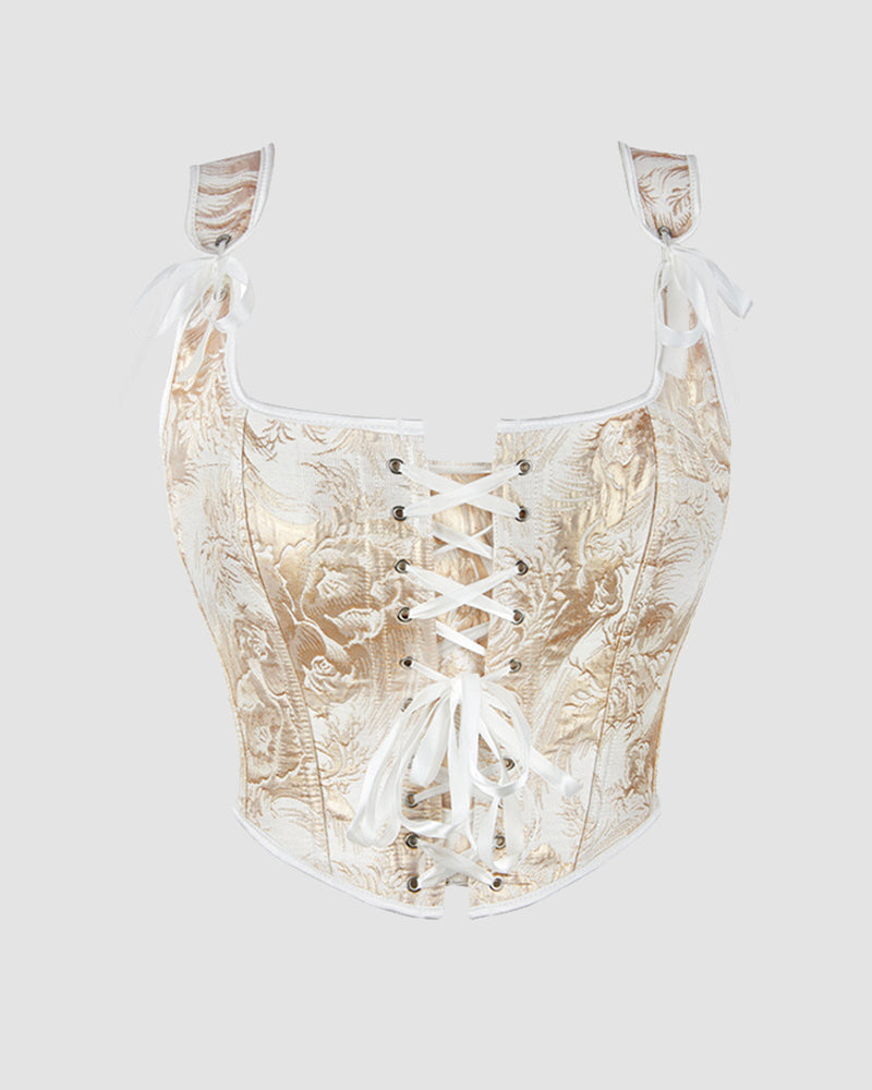 1950s golden corset with floral pattern, lace-up front, and white straps